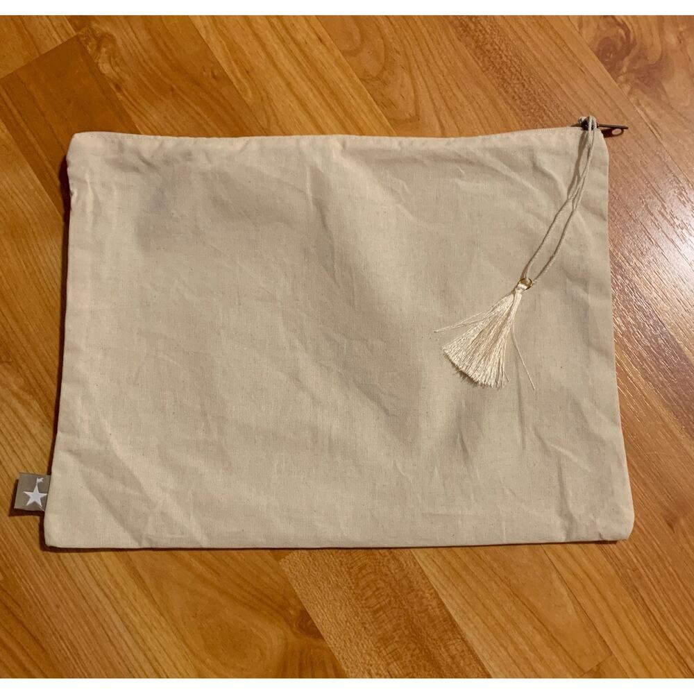 Swimsuit fabric bag with tassel